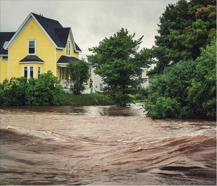 A house is surrounded by floodwater