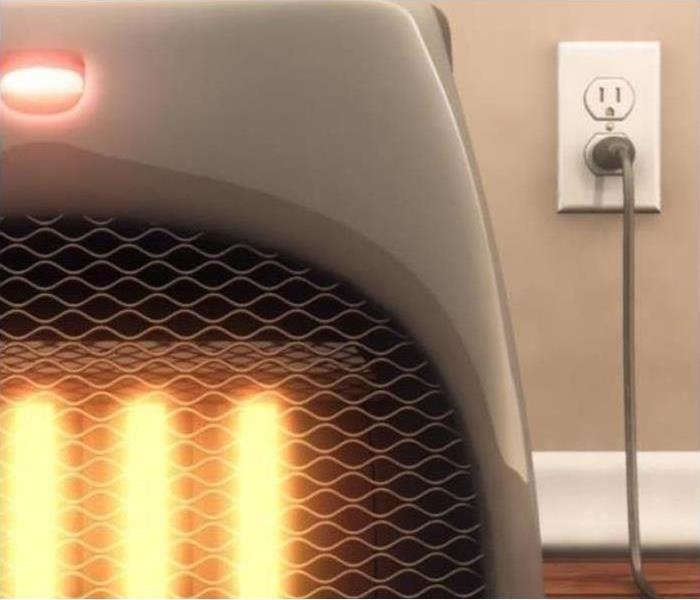 A space heater is plugged into an outlet.