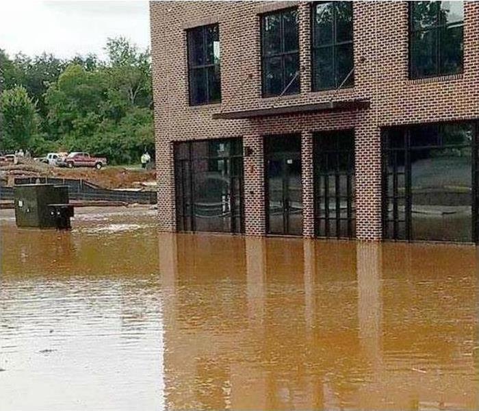 An office building is surrounded by flood water