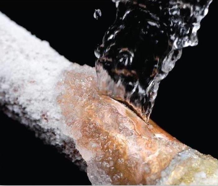 Water bursts from a frozen and ruptured pipe